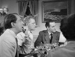 The dinner guests are captivated by Watson's story